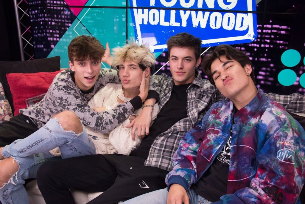 Four Young Hollywood guests posing together on the studio set